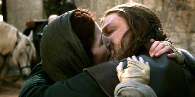 Sean Bean as Ned Stark and Michelle Fairley as Catelyn kissing goodbye in Game of Thrones