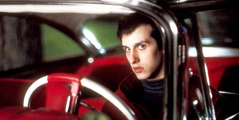 Arnie sitting in Christine car.