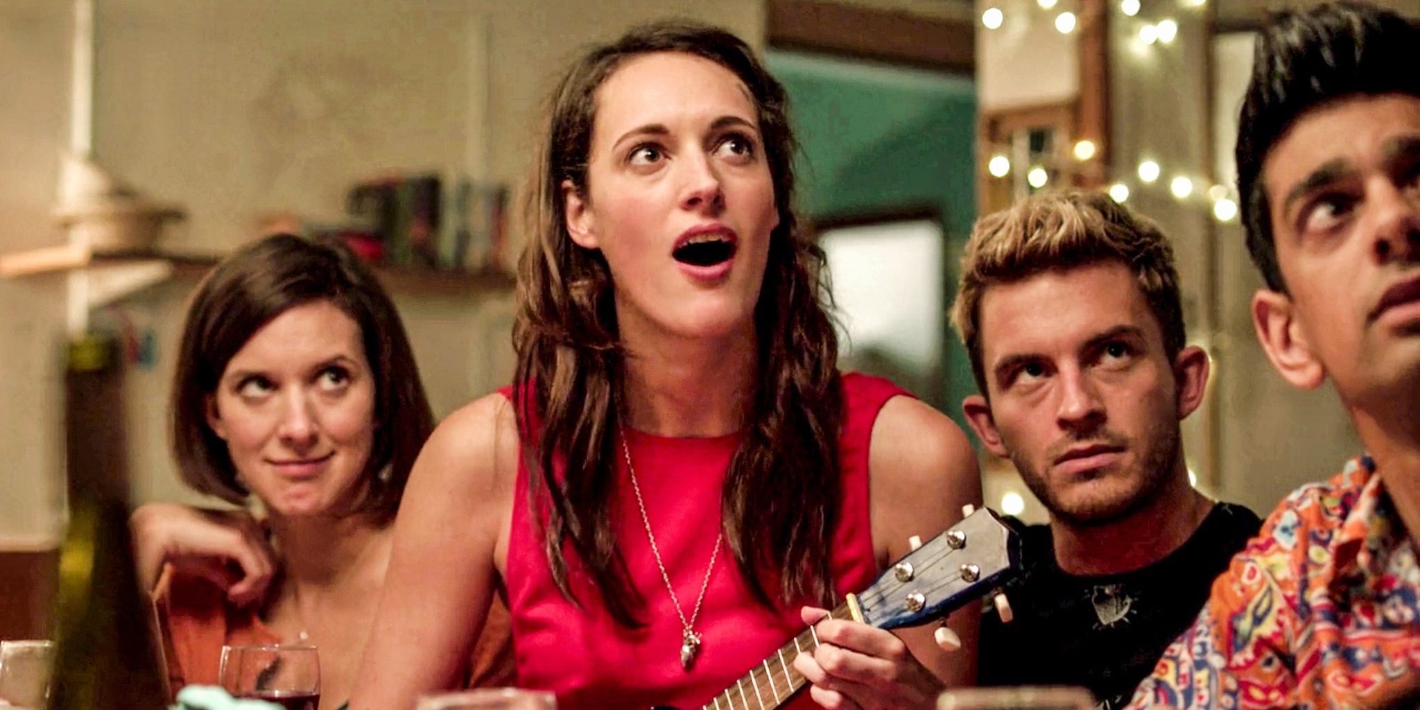Lulu plays the ukulele with Kate and Sam standing behind her in Crashing.