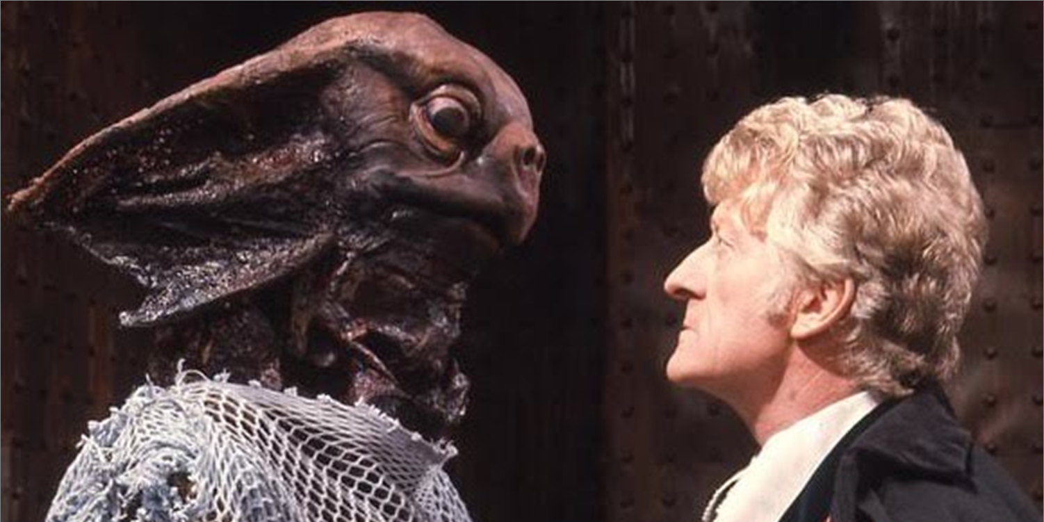 The Third Doctor stands face to face with a Sea Devil in Doctor Who