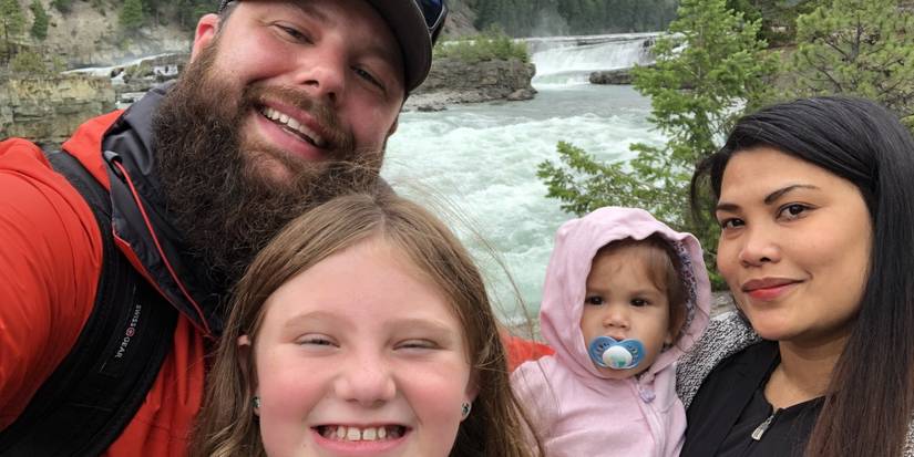 Brett and Daya smiling with their children after 90 Day Fiance