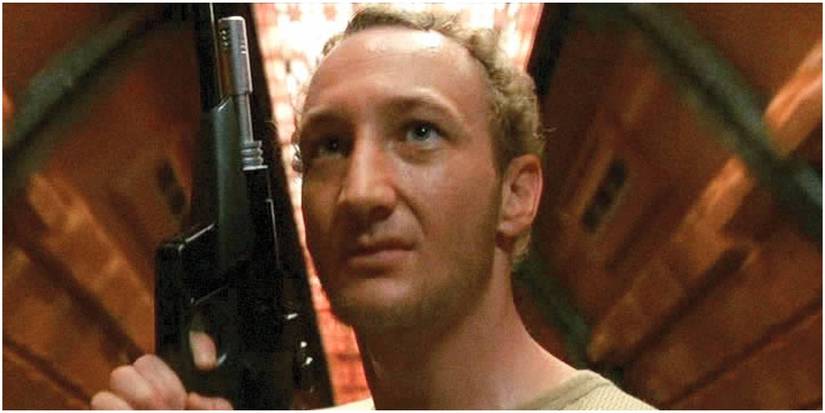 Robert Englund holds a gun in Galaxy of Terror