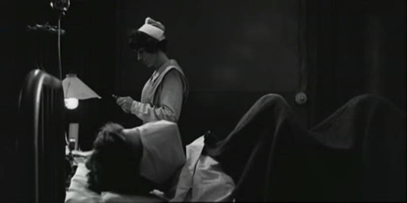 A man has his face covered while lying on a hospital bed in the film Johnny Got His Gun