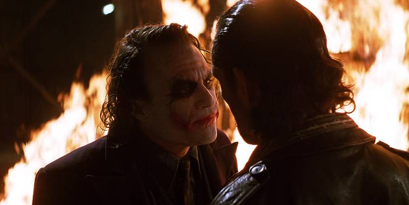 The Joker burns his half of the money in The Dark Knight