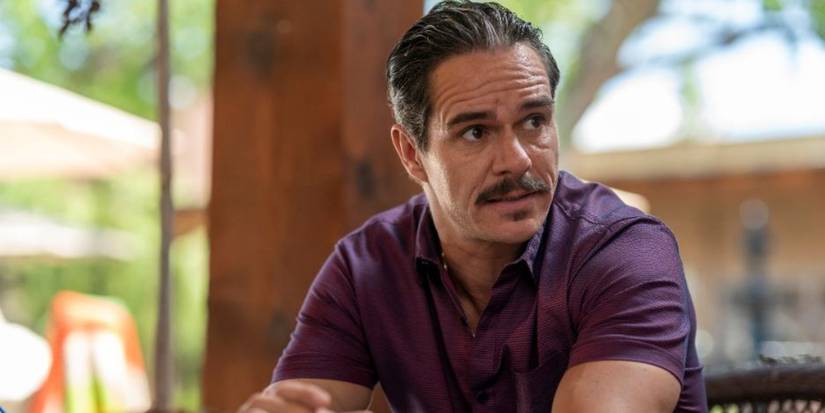 Lalo Salamanca in Better Call Saul sitting in a purple shirt