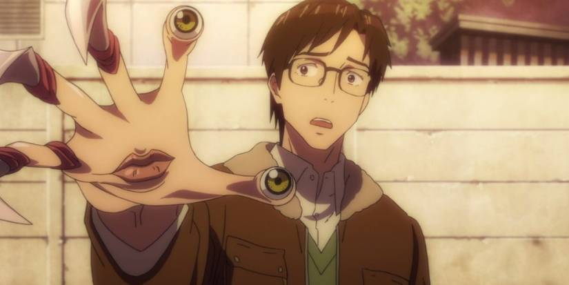 Shinchi stares at his hand as it produces eyes and claws in Parasyte The Maxim