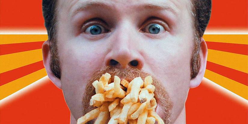 Morgan Spurlock tem batatas fritas na boca no pôster de Supersize Me