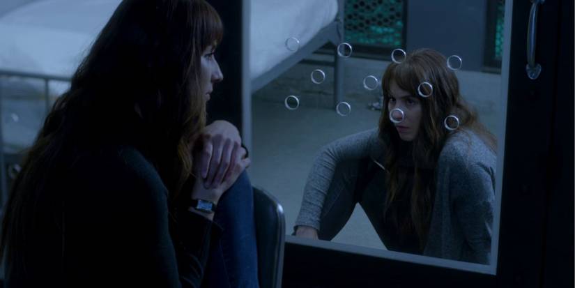 Spencer and Alex staring at each other on Pretty Little Liars