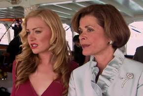 Jessica Walter as Luciille and Portia de Rossi as Lindsay looking out across the water at the boat of pirates in disgust in Arrested Development's pilot.