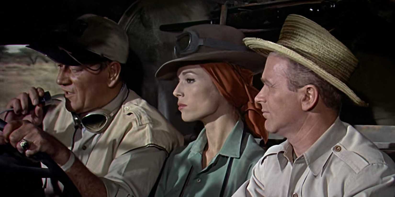 John Wayne as Sean driving a truck in Hatari