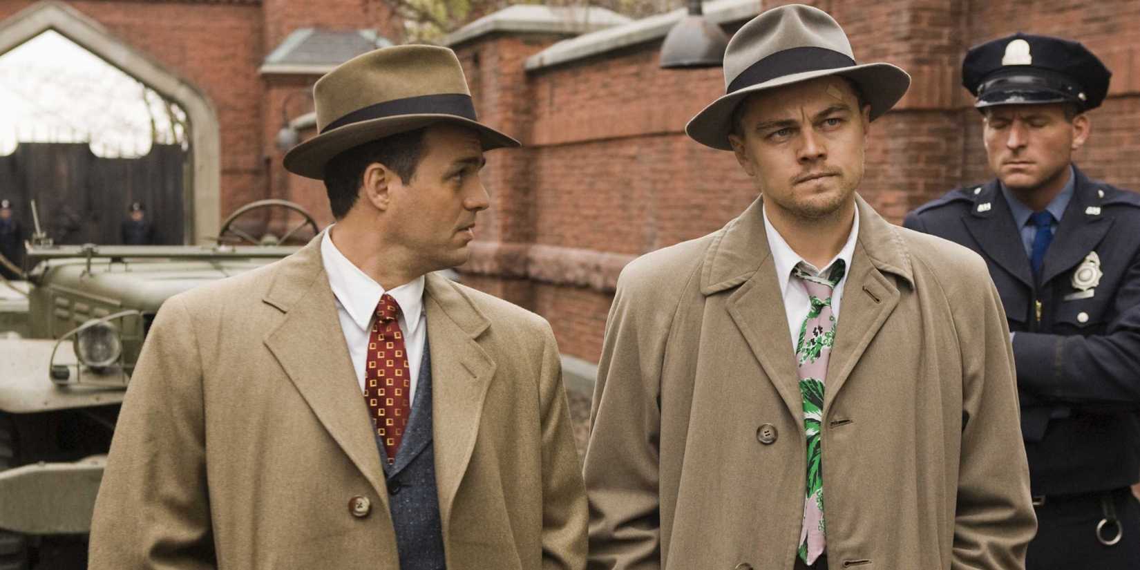 Mark Ruffalo and Leonardo DiCaprio standing next to each other and investigating in Shutter Island