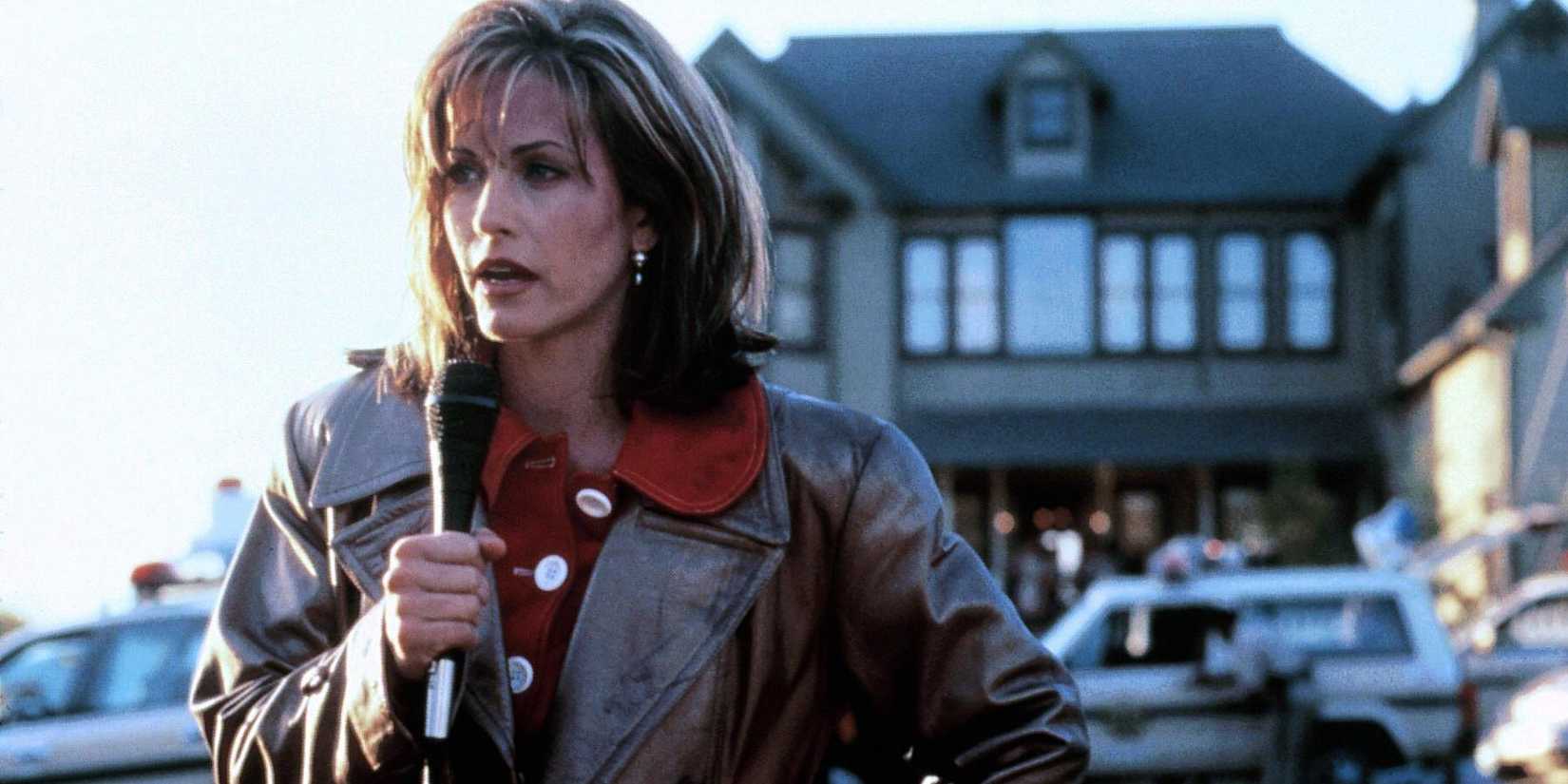 Scream 7 Proves Why Gale Weathers Is The Real Franchise MVP 1 Courtney Cox as Gale Weathers Standing Outside the Macher House in Scream 1996
