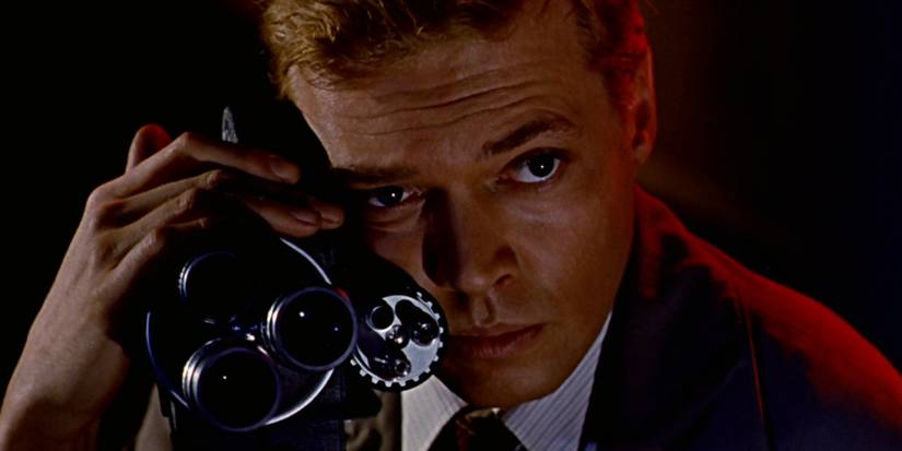 Close-up of Mark Lewis on the camera he uses to photograph the woman.