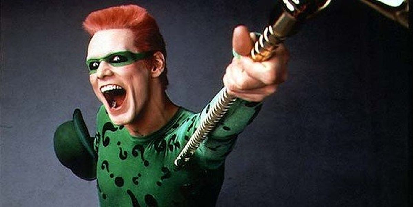 Riddler holding out his cane in Batman Forever