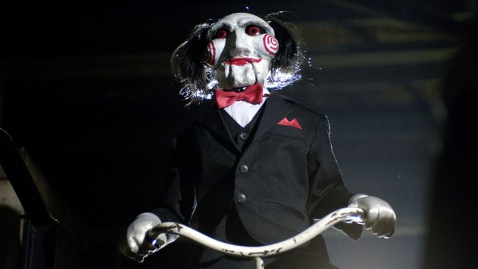 Billy the Puppet on a bicycle in Saw II