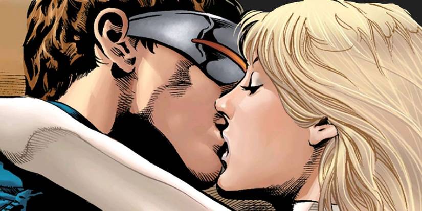 Close up of Cyclops and Emma Frost locking lips.