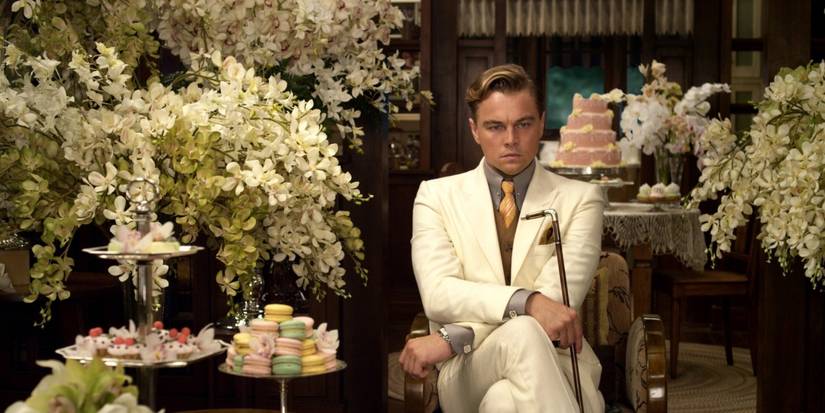 The Great Gatsby's Best Quote Isn't the One Everyone Thinks 1 Gatsby in a room full of flowers in The Great Gatsby