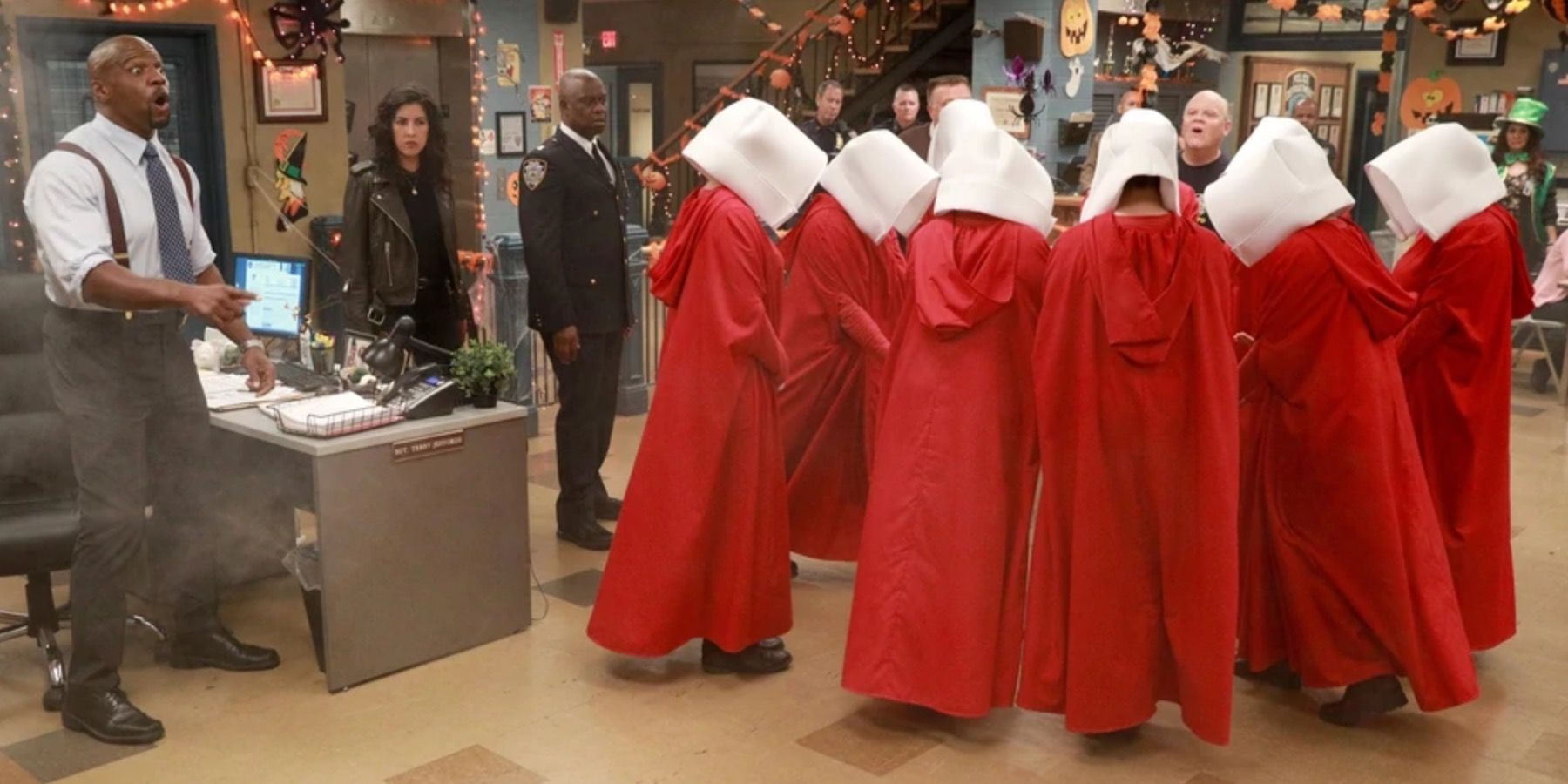 People dressed as Handmaid's Tale characters in the 99th precinct in Brooklyn Nine Nine
