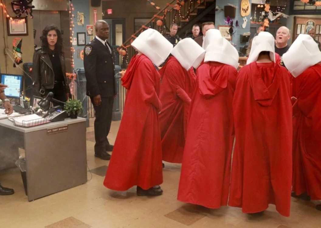 People dressed as Handmaid's Tale characters in the 99th precinct in Brooklyn Nine Nine