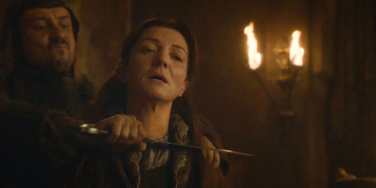 Catelyn Stark's throat being slit by a Frey man in Game of Thrones