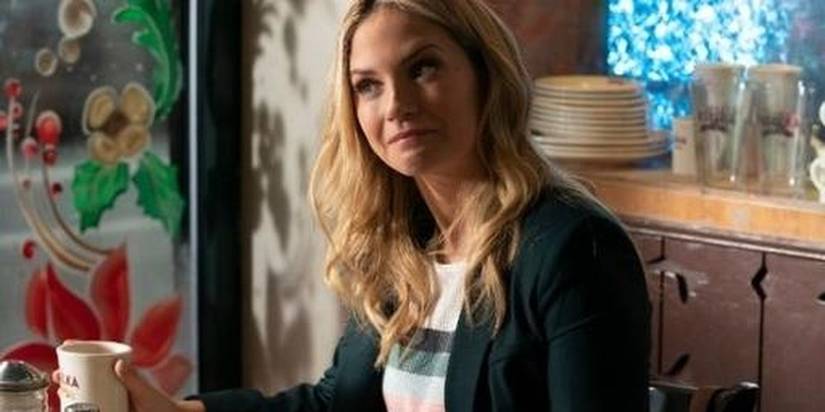 Eddie holding a coffee cup in Blue Bloods