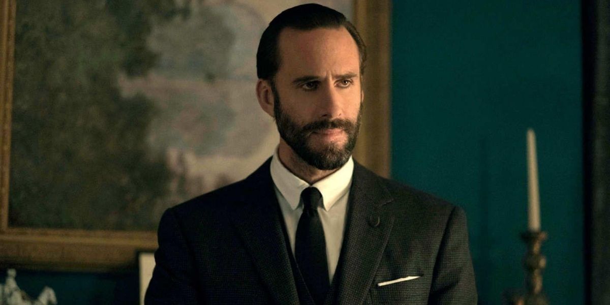 Fred Waterford from The Handmaid&rsquo;s Tale wearing a suit and looking angry.
