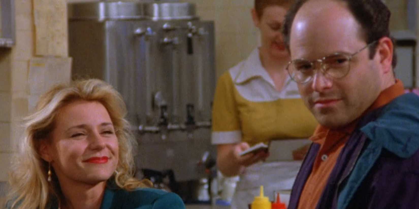 George Costanza (Jason Alexander) smiling back after a woman laughs at his joke in Seinfeld, The Opposite.