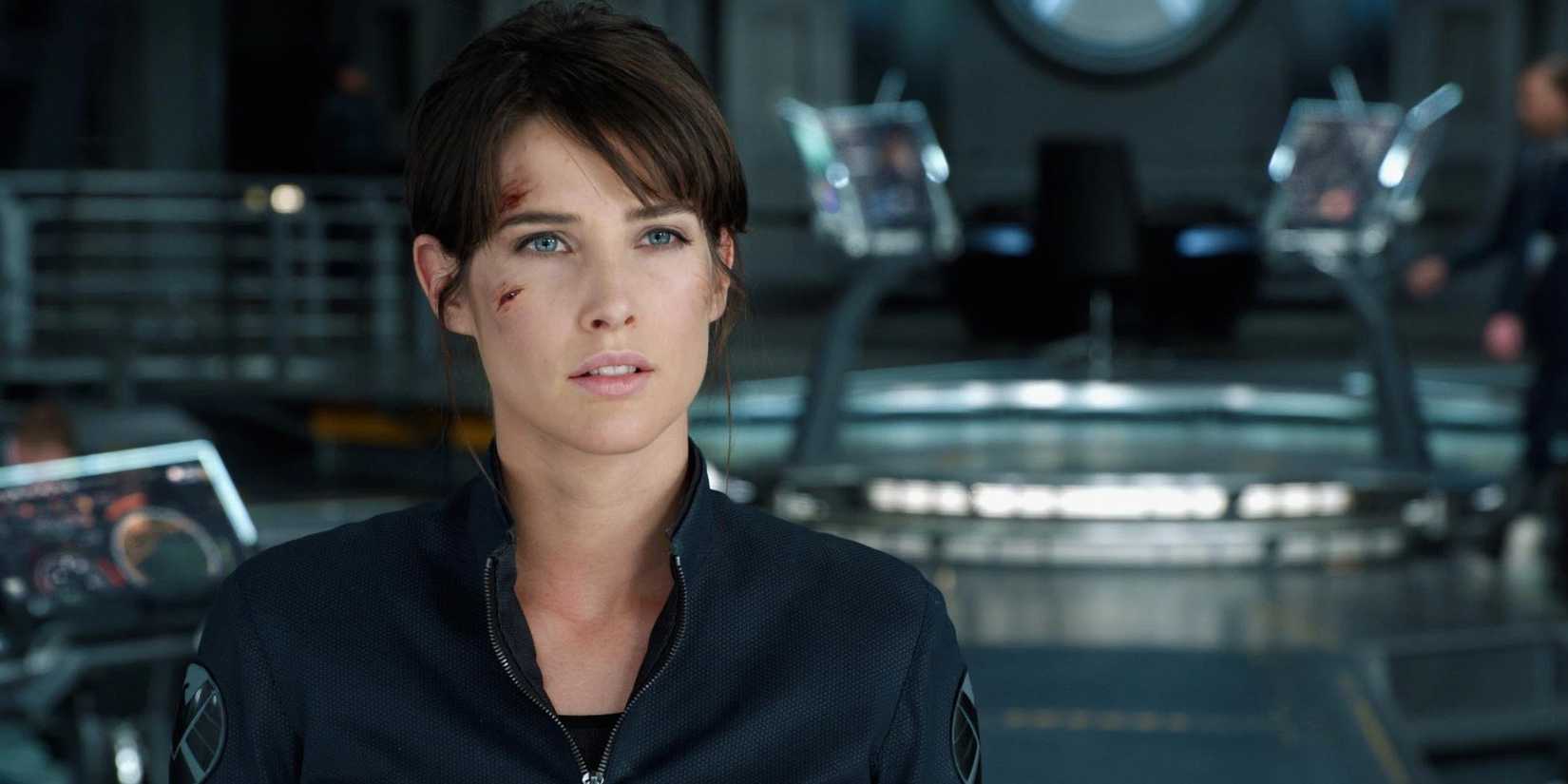 Maria Hill listening to Nick Fury in The Avengers