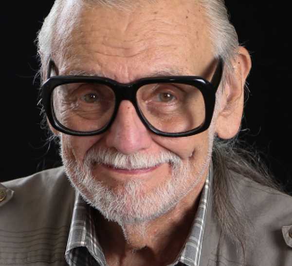 George A. Romero smiling with his glasses on