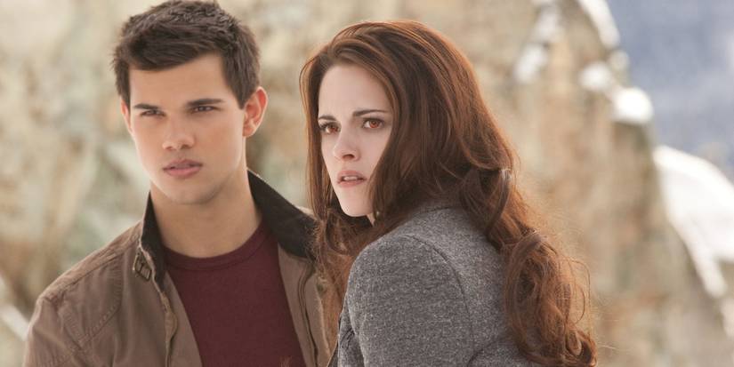 Taylor Lautner as Jacob Black alongside Kristen Stewart as Bella Cullen in Breaking Dawn