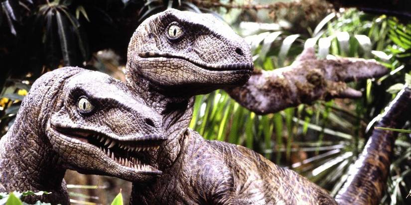 Two Velociraptors surrounded by some trees in Jurᴀssic Park