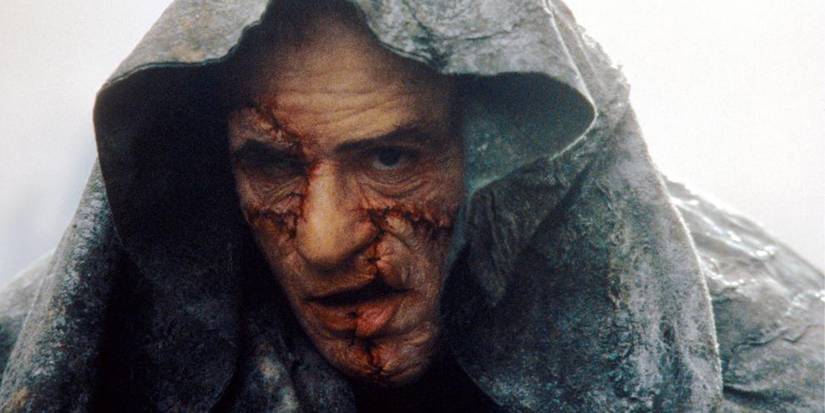 Robert De Niro as the Monster grimmacing in a hood in Mary Shelley's Frankenstein 1994