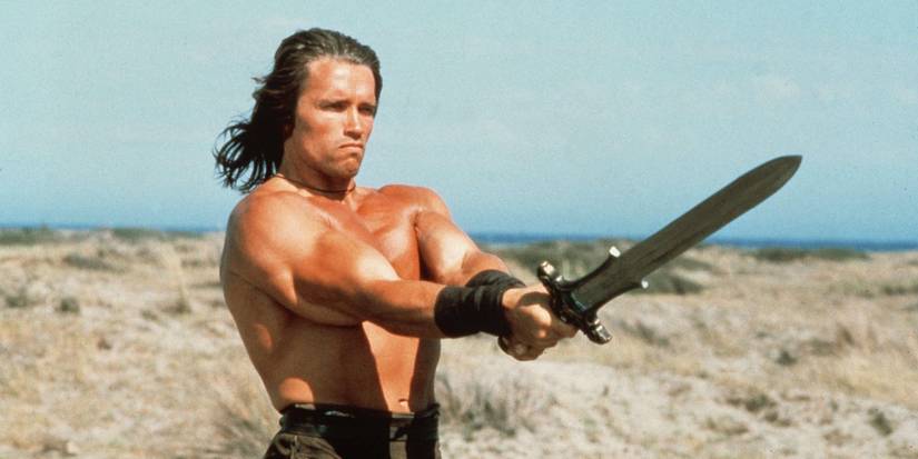 Arnold Schwarzenegger in Conan the Barbarian wielding his sword.