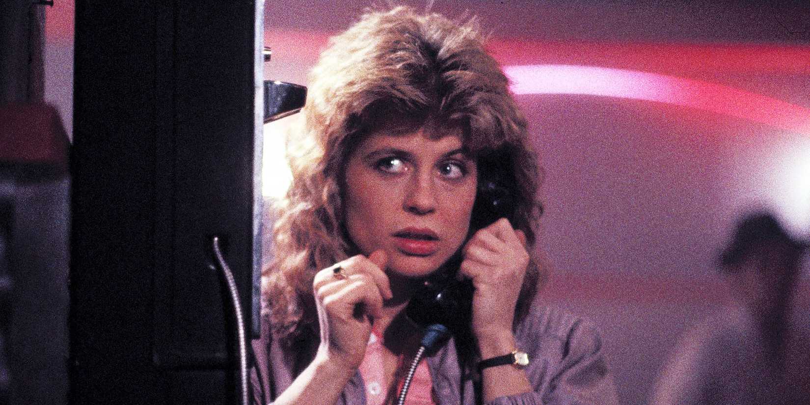 Linda Hamilton as Sarah Connor talking on a payphone in The Terminator