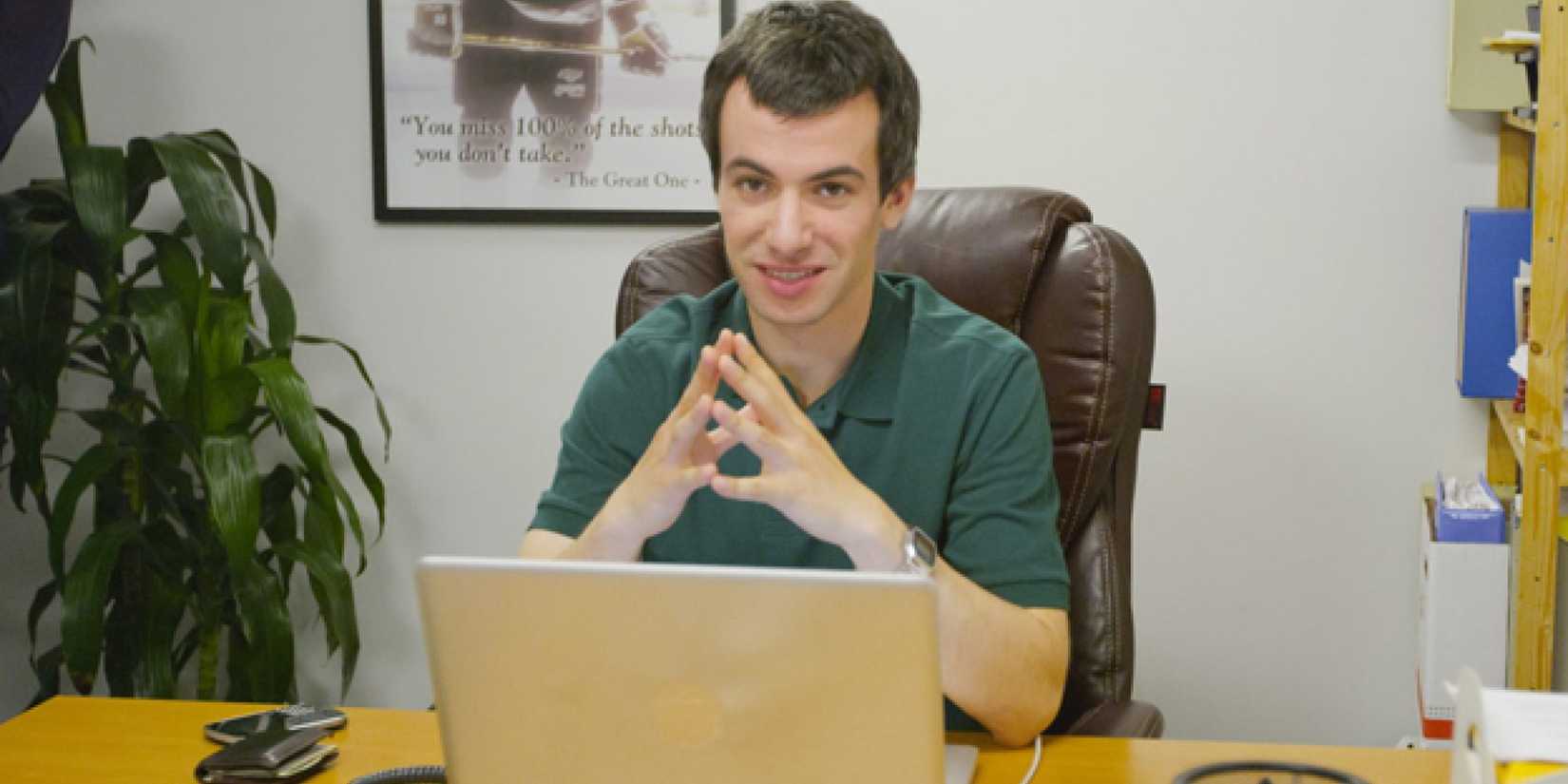 Nathan Fielder sitting at a desk in Nathan For You