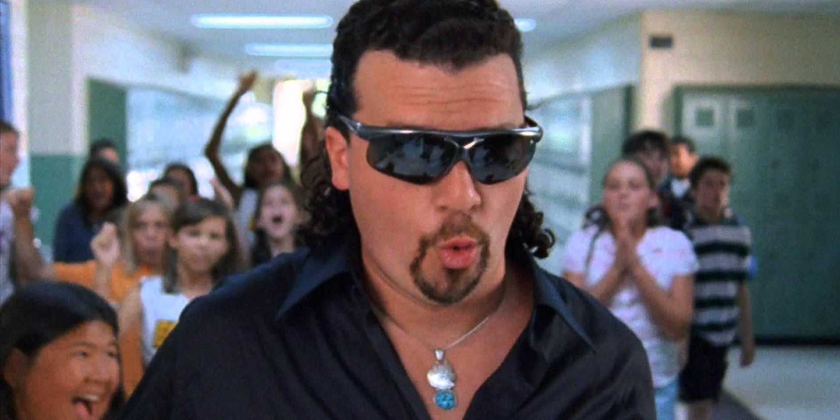 Kenny Powers walking down the school hall as children cheer behind him in Eastbound & Down