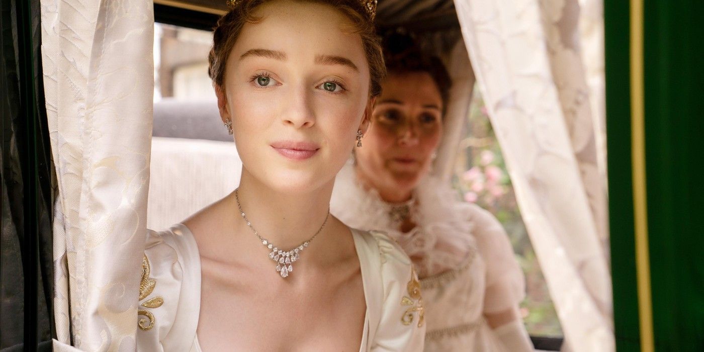 Phoebe Dynevor as Daphne Bridgerton looking out the window of a coach in Bridgerton