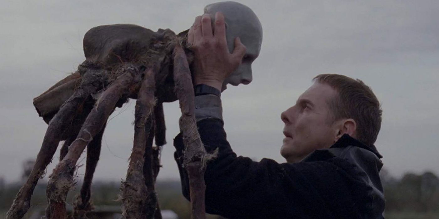 man holding spider puppet
