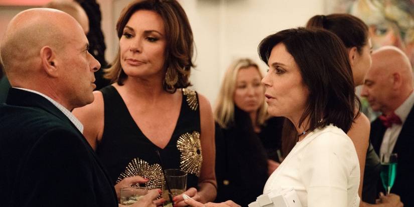 Tom, Luann, and Bethenny talking at a party on RHONY