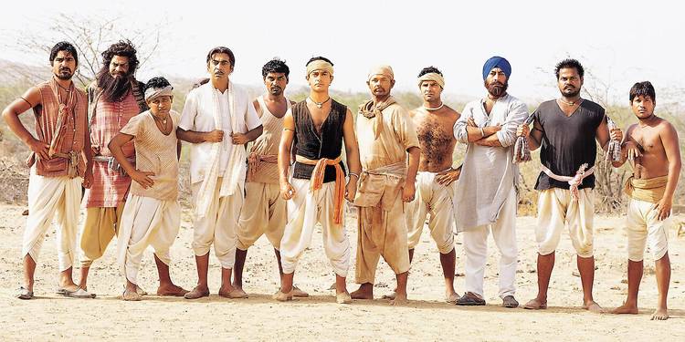 The team in Lagaan standing side by side outside and looking at the camera