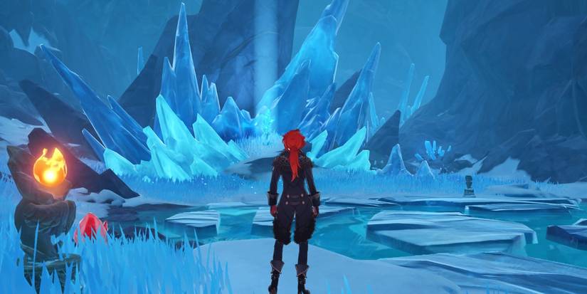 Diluc is looking at the strange ice shard in Starglow Cavern in Genshin Impact.