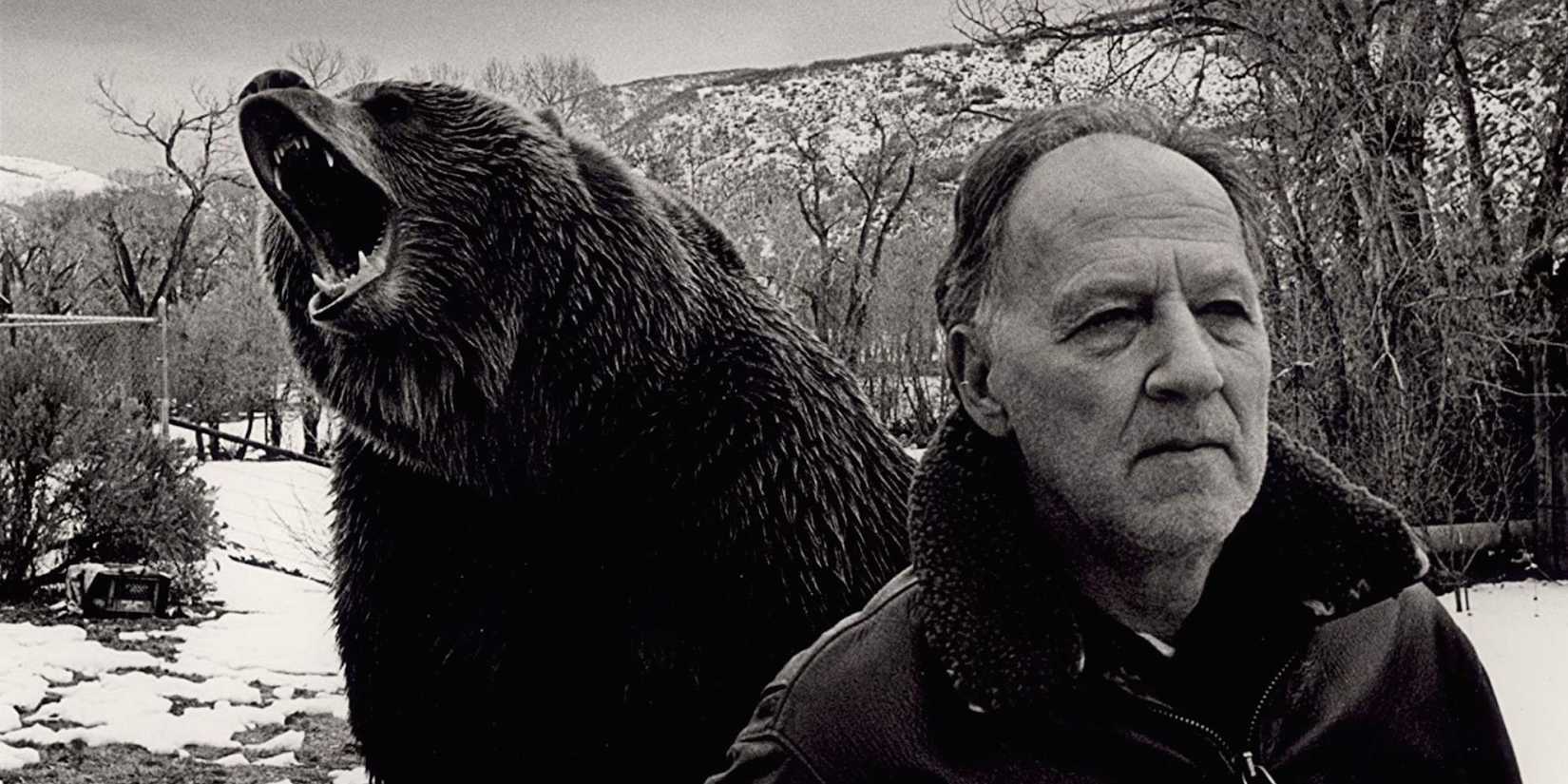 Timothy Treadwell and a roaring bear behind him