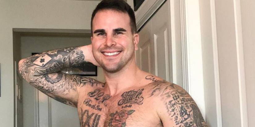 The Bachelorette's Josh Seiter smiling with hand touching back of neck