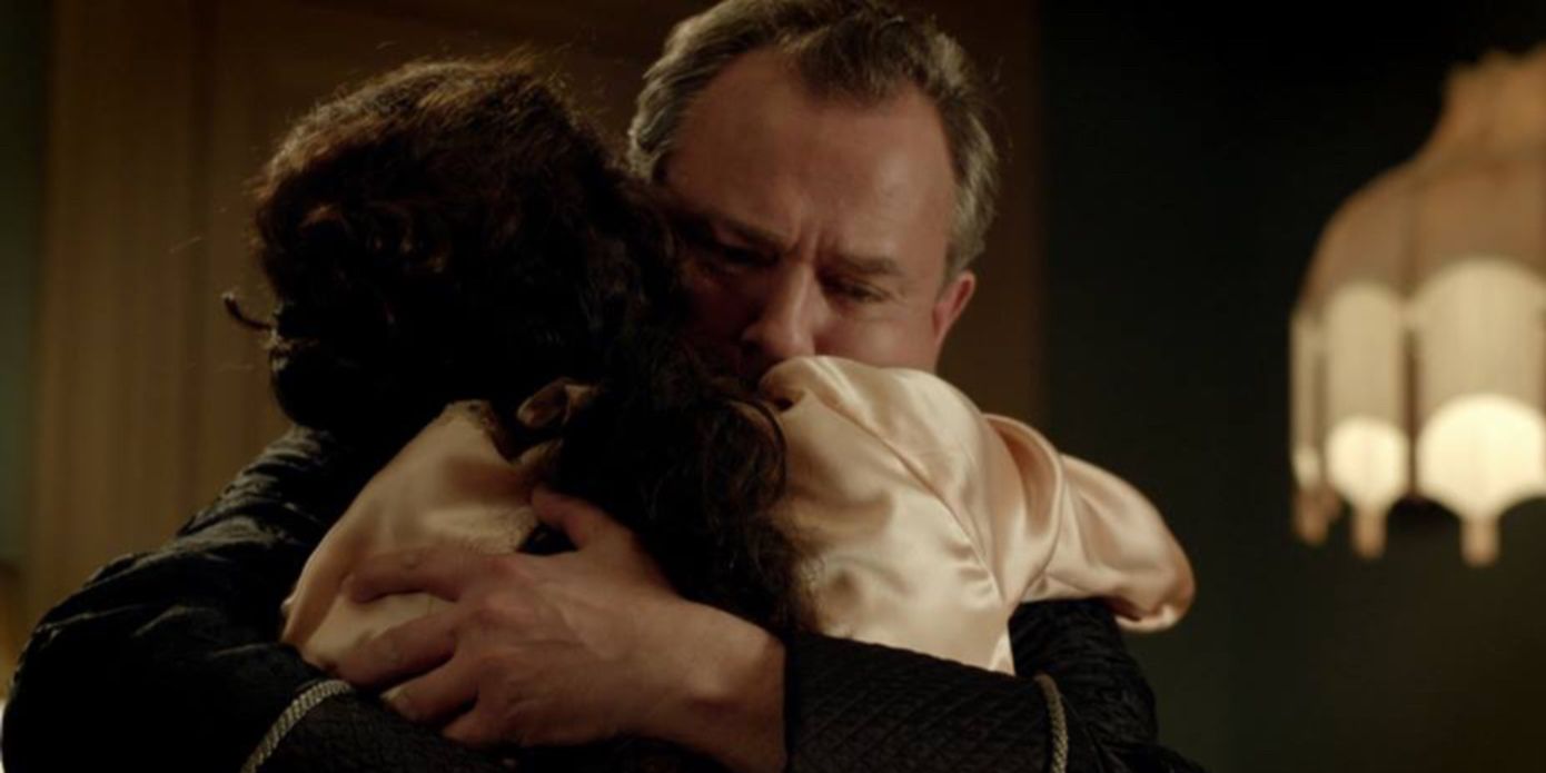 Robert and Cora Crawley hugging each other in Downton Abbey