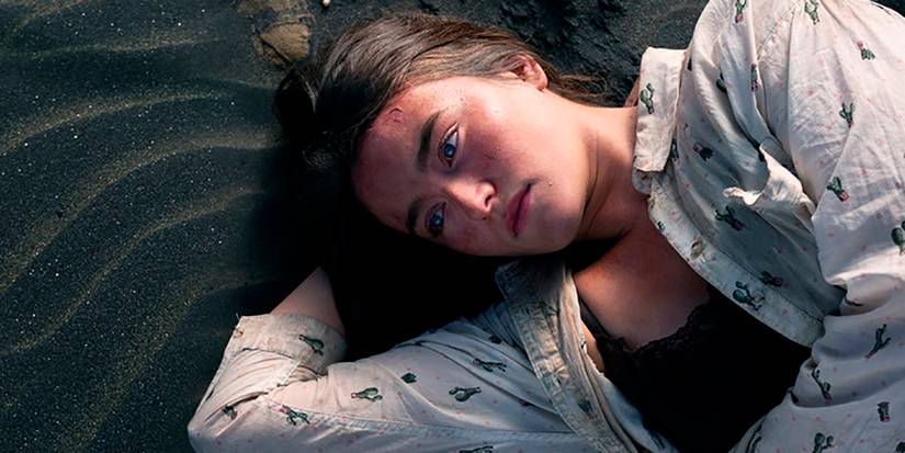 Leah laying on the beach in The Wilds season 1