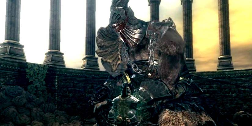 Hawkeye Gough from Dark Souls 2 standing bloody.