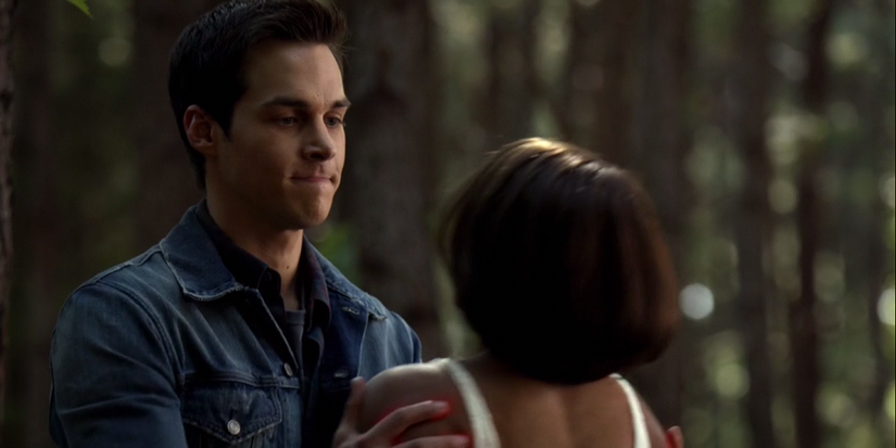 Kai Parker holding Bonnie Bennett by the shoulders in The Vampire Diaries