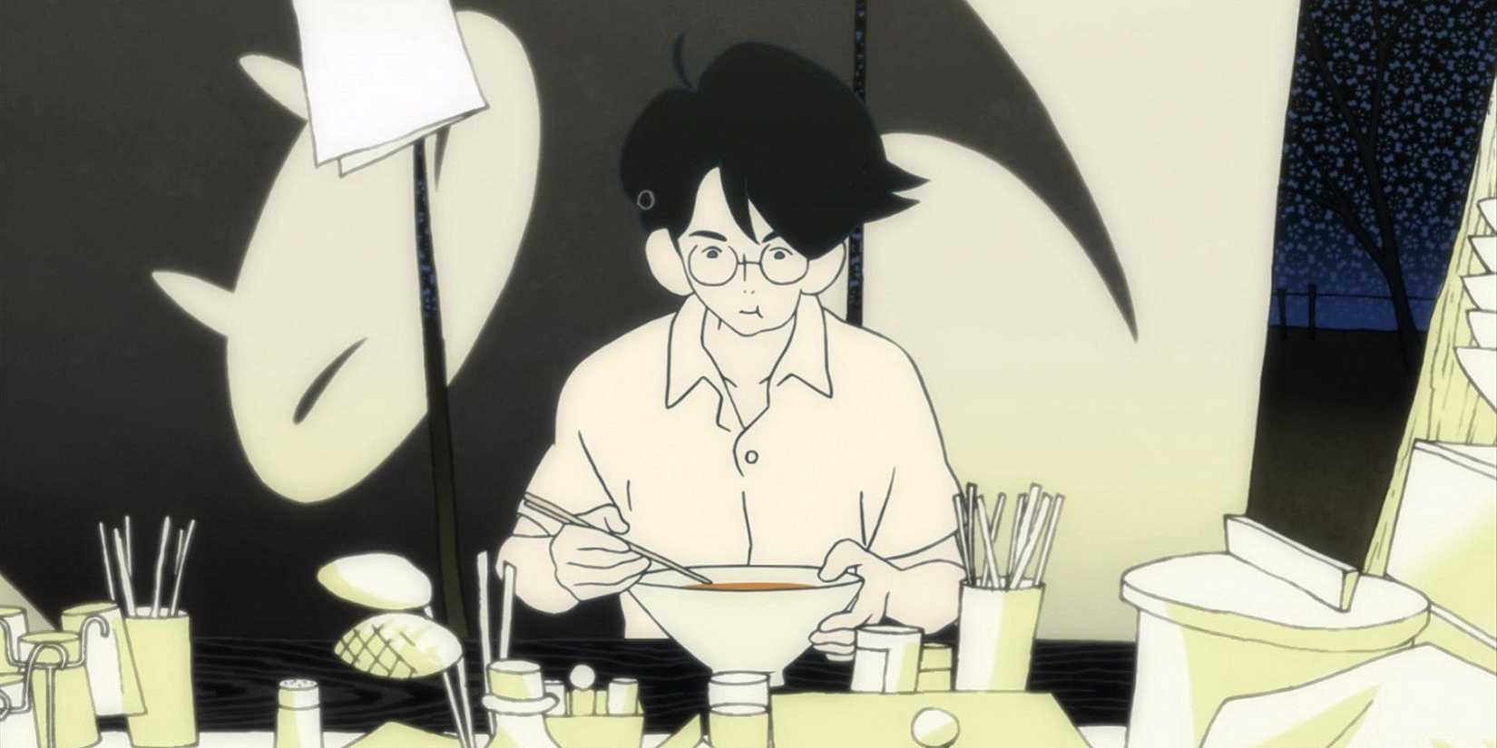 The Tatami Galaxy scene at ramen restaurant, depicting the main character sitting at a table eating noodles.