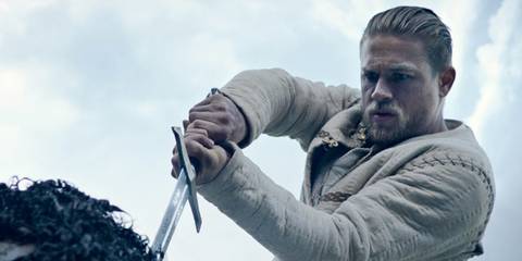 Arthur removing sword from stone in King Arthur: Legend of the Sword