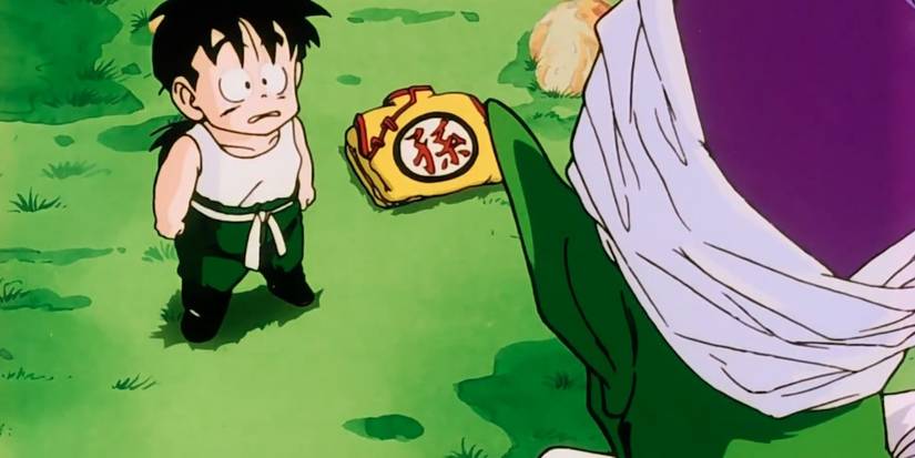Piccolo standing before a scared, child Gohan during their training.